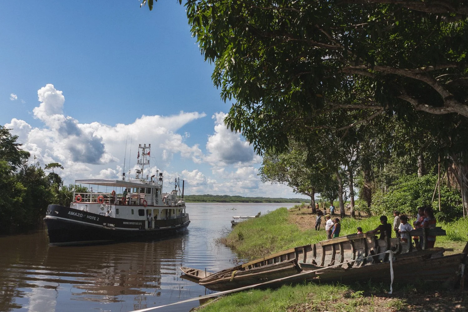 The Amazon Hope II medical mission boat arrives at a riverside village, bringing healthcare and aid to remote communities.