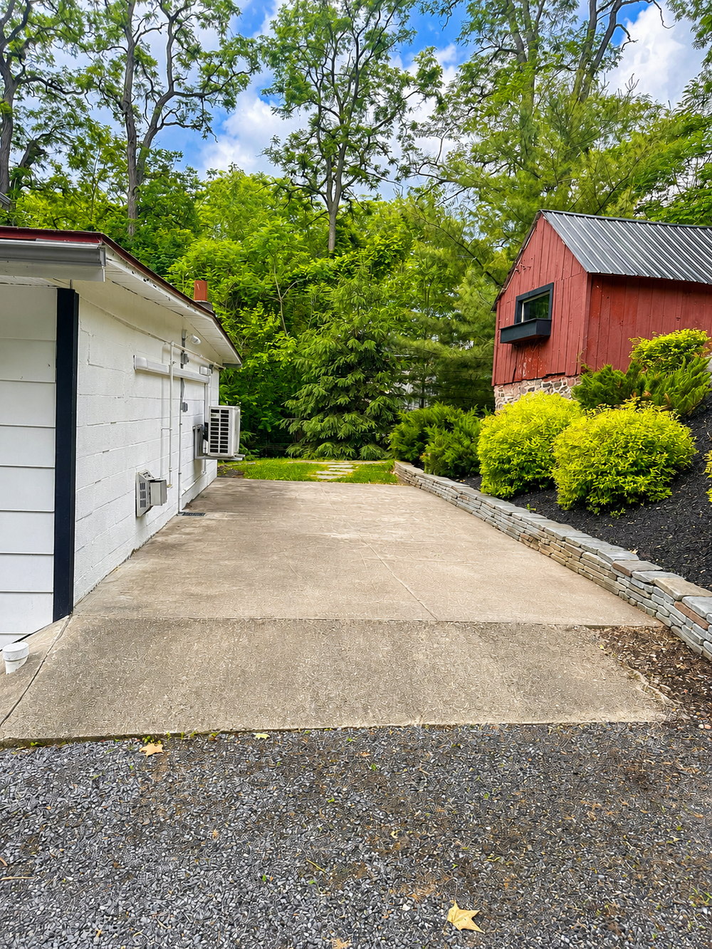Small camper and RV parking pad beside the building at Keuka Cove House