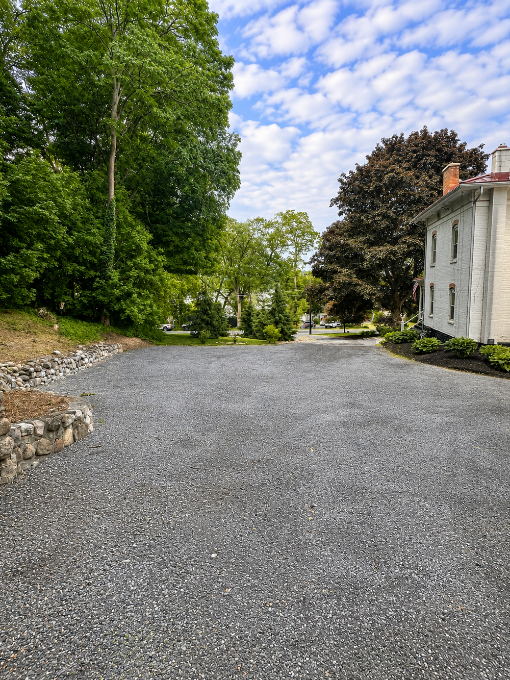 Top of driveway looking toward the road and lake access area