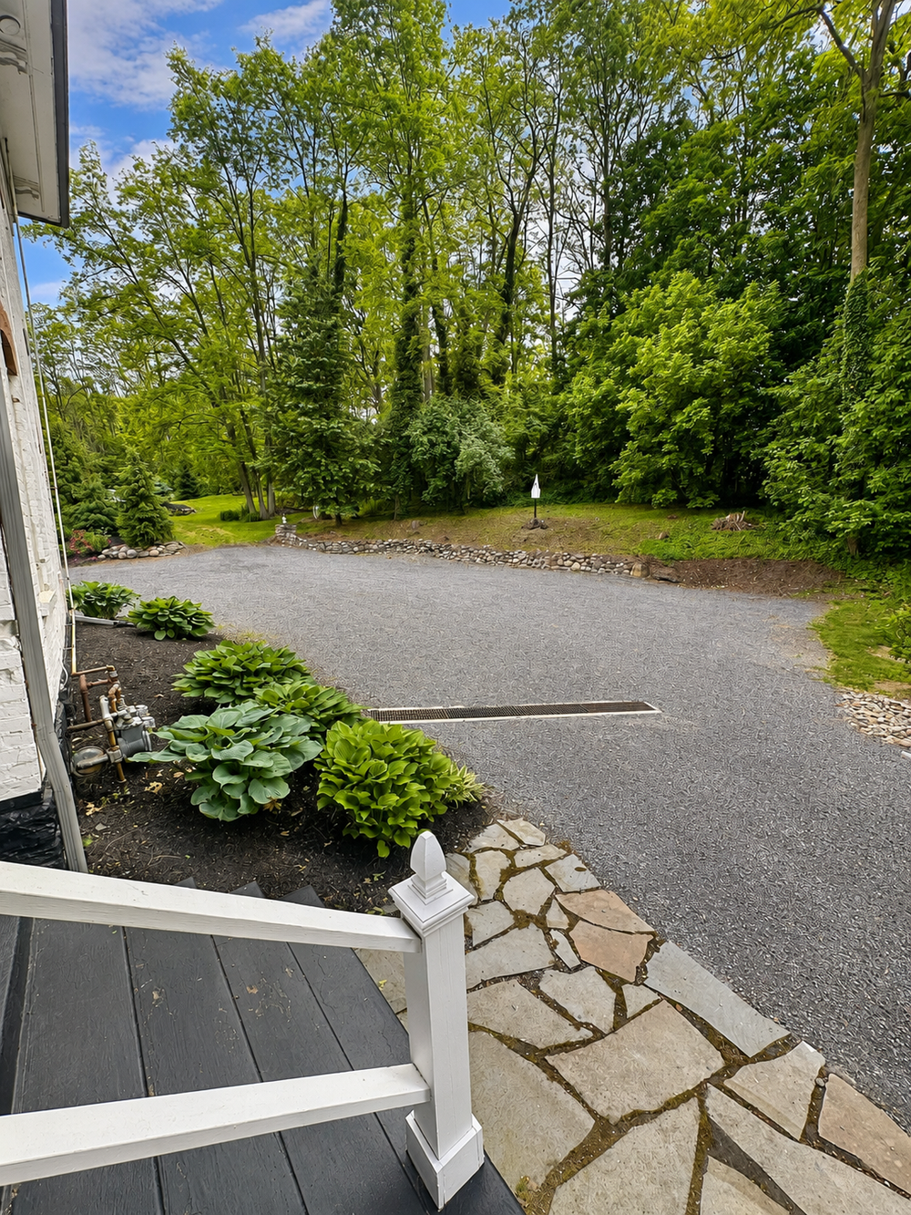 View up the back driveway from the front deck entrance