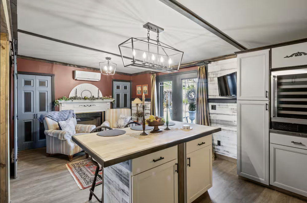 Unit 3 kitchen and living area with island seating and open apartment layout