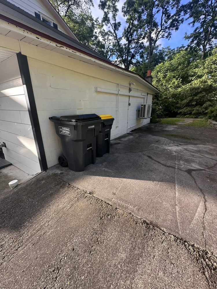 Trash and recycling bins located behind Unit 3 at the Keuka Cove House