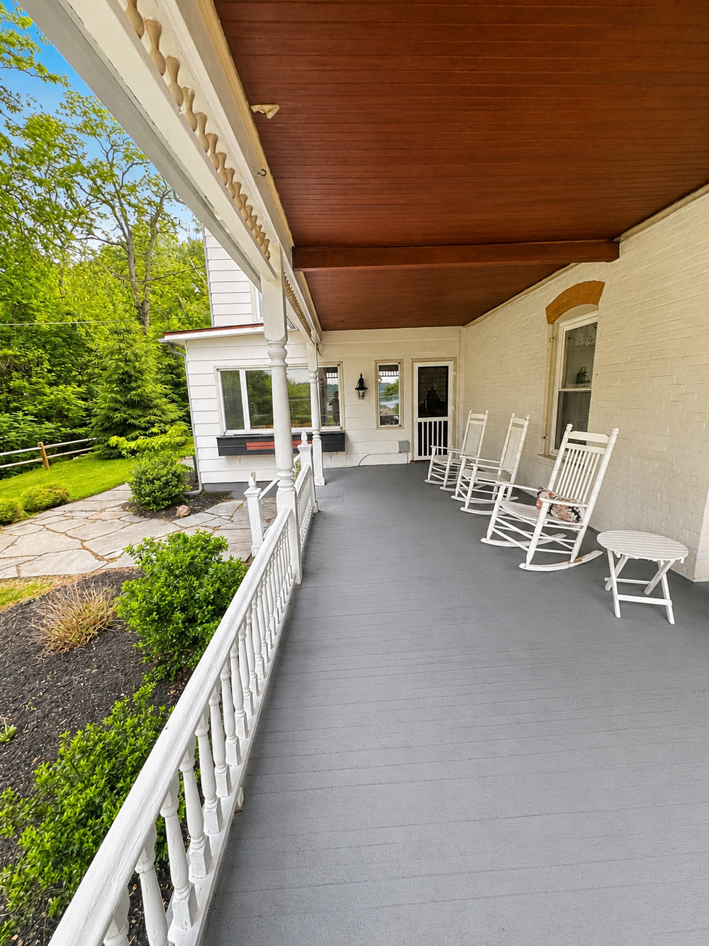Covered front deck view with porch seating