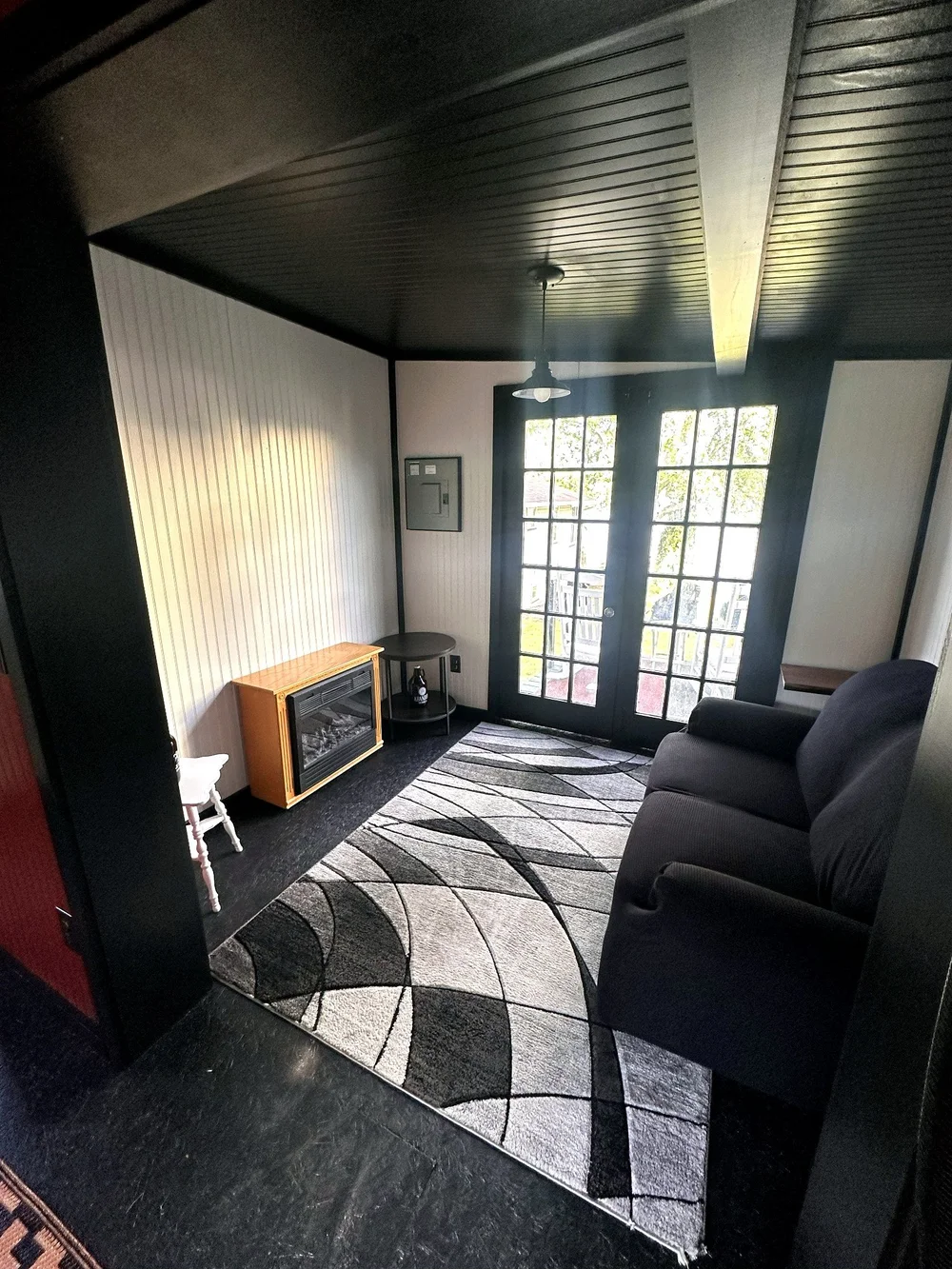 Boathouse lounge interior looking toward the lake-facing doors