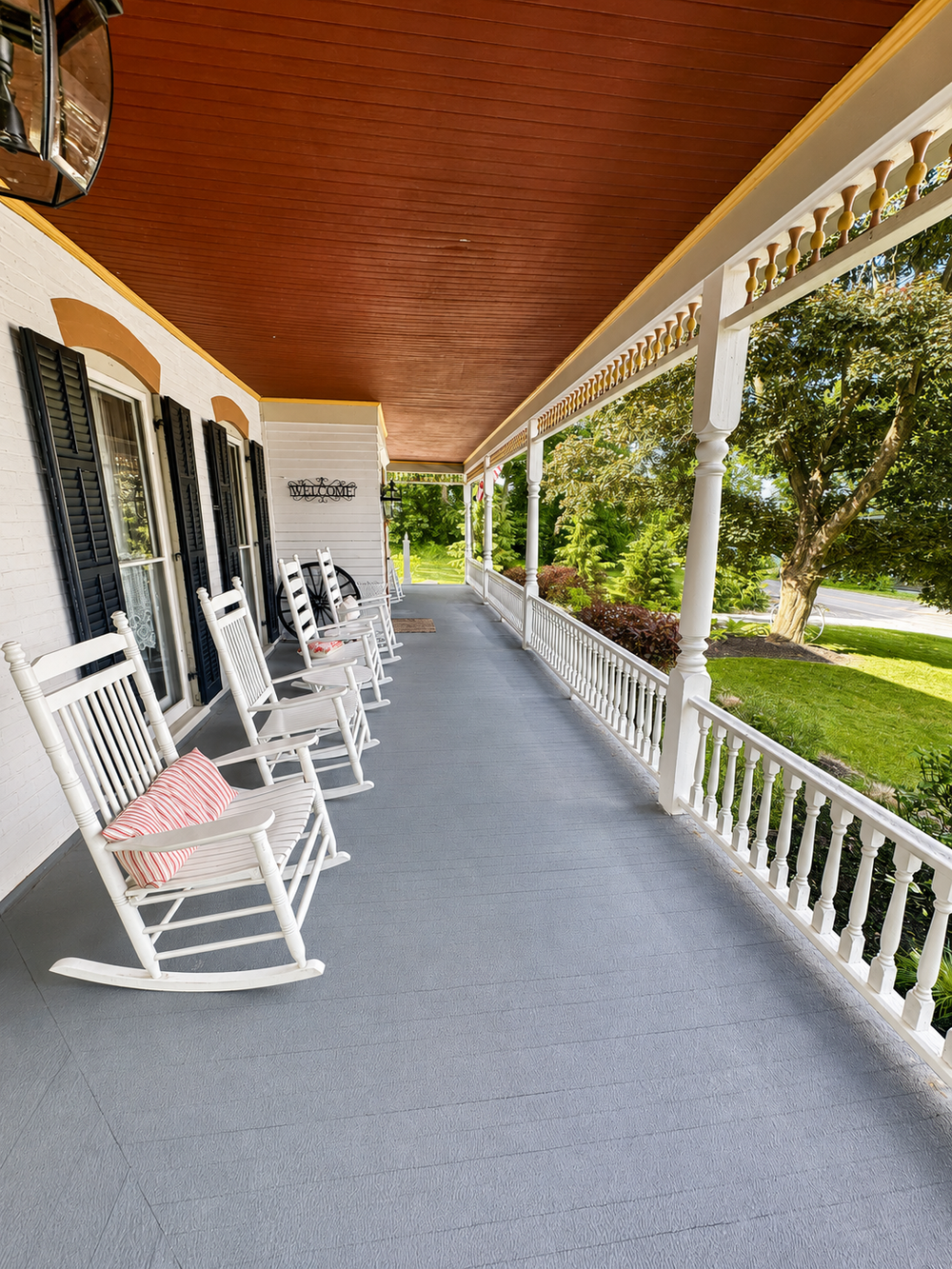 Front deck side view with rocking chairs and covered porch seating