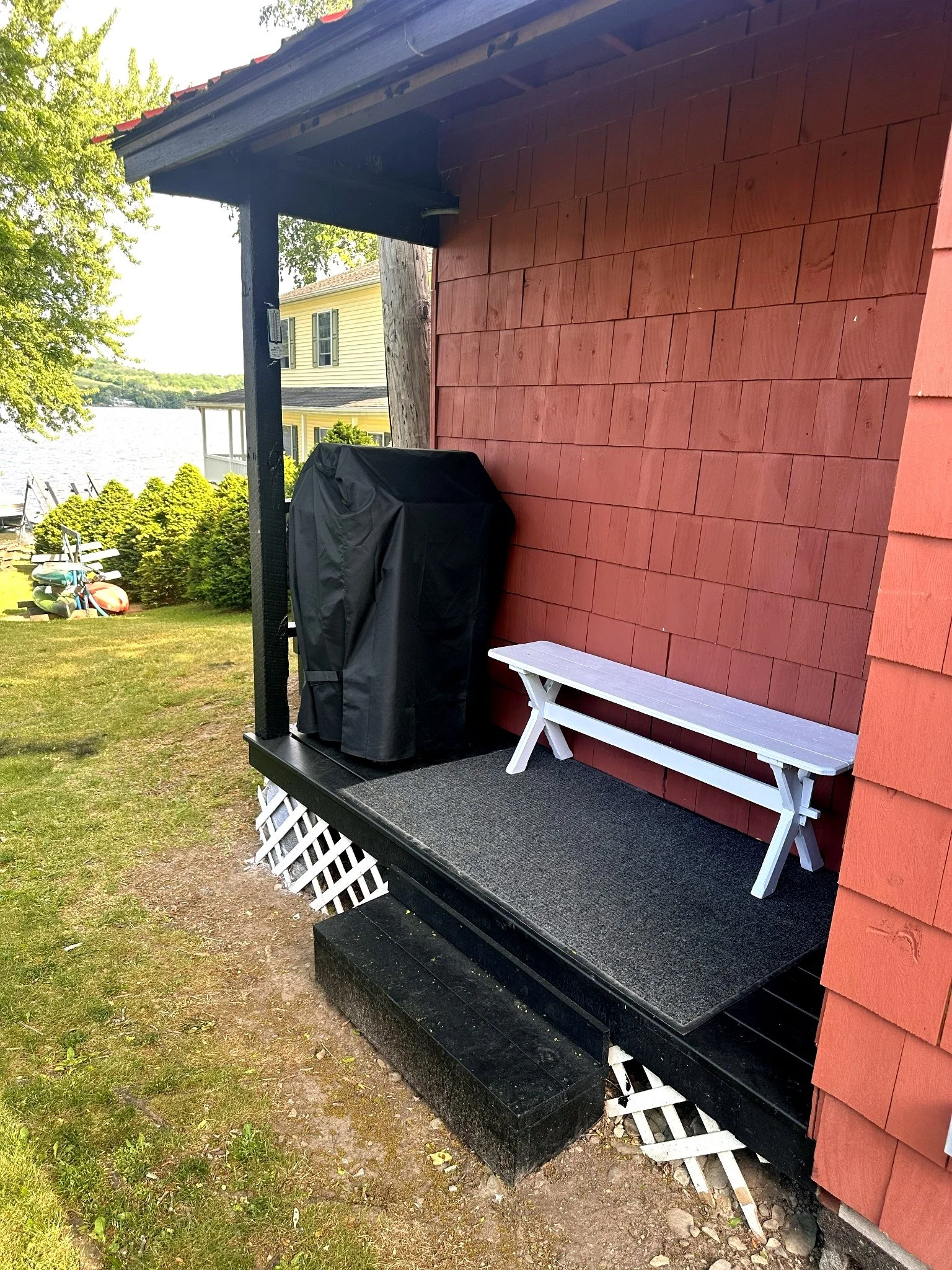Boathouse side deck with grill and lakefront access
