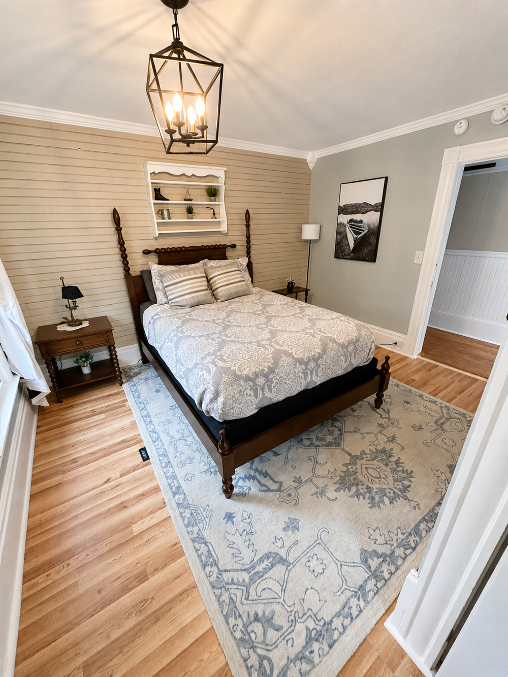 Additional view of Unit 4 Bedroom 1 with queen bed and natural light