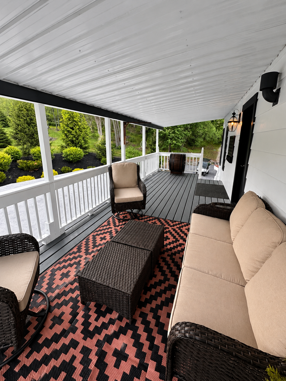 Back deck view showing the outdoor furniture and covered seating area