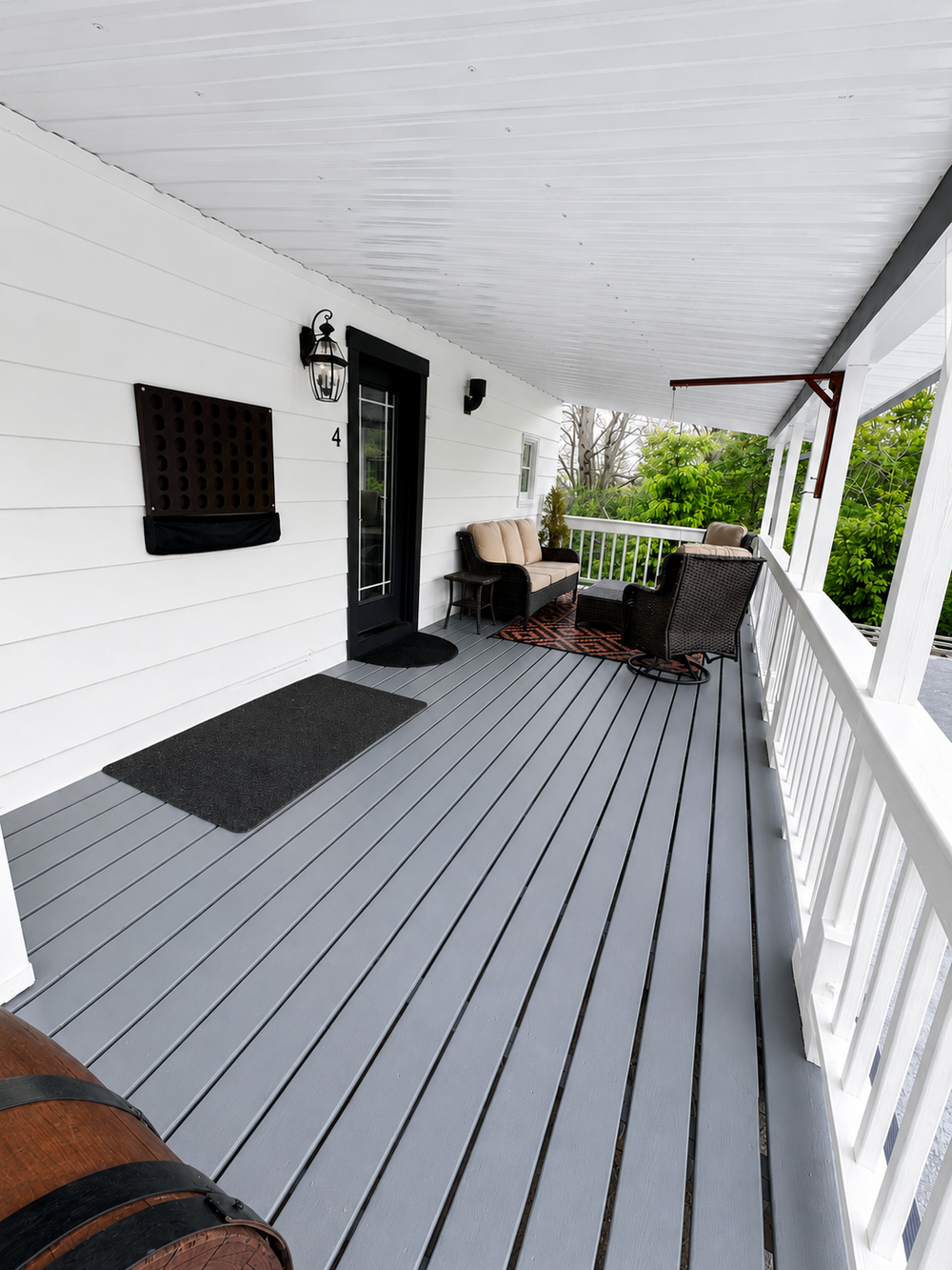 Back deck entrance view with covered outdoor seating area