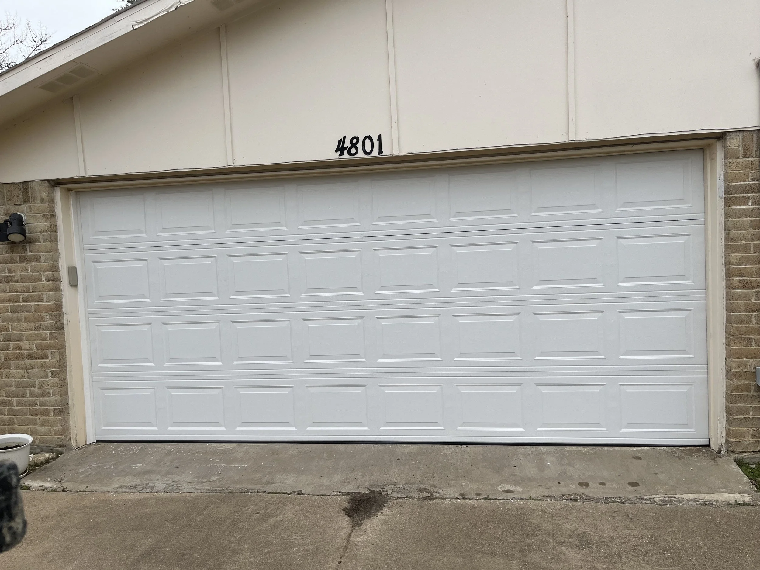 White garage door with raised panel design