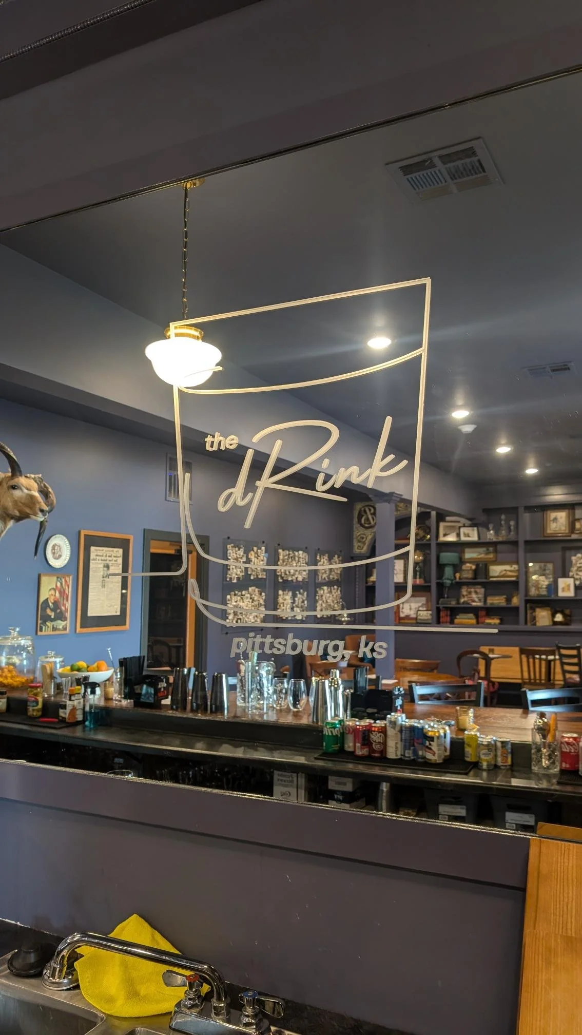 dRink logo graphic on a mirror