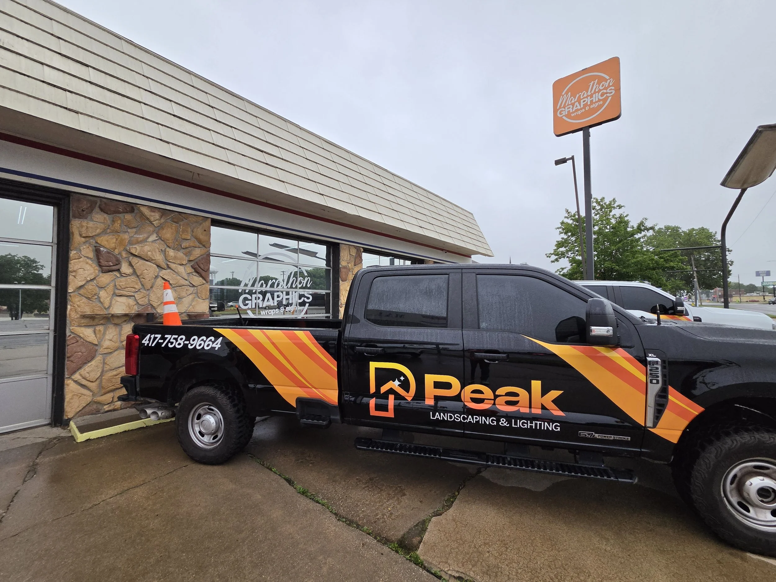 Truck door and cab graphics for Peak Landscaping & Lighting