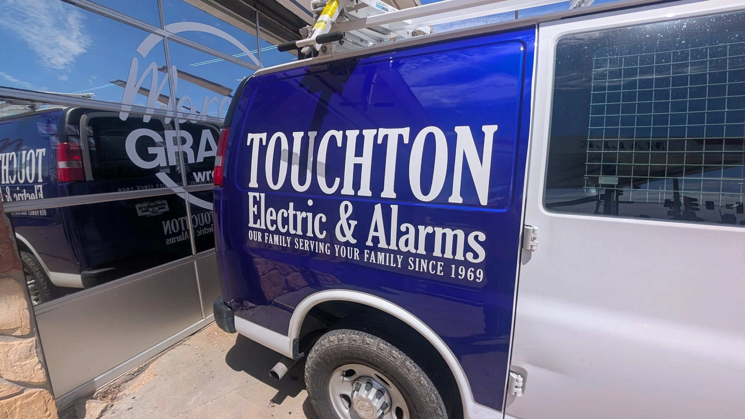 Touchton Electric & Alarms Spot graphic on a van