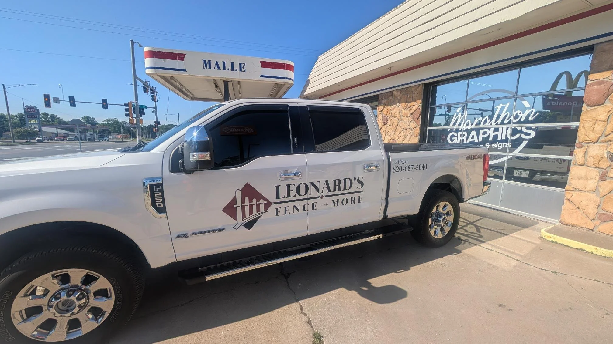 Leonard's Fence and More spot graphic on the side of a truck