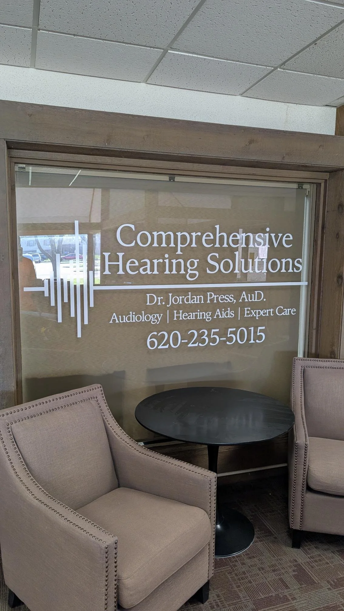 Comprehensive Hearing Solutions window Graphic logo