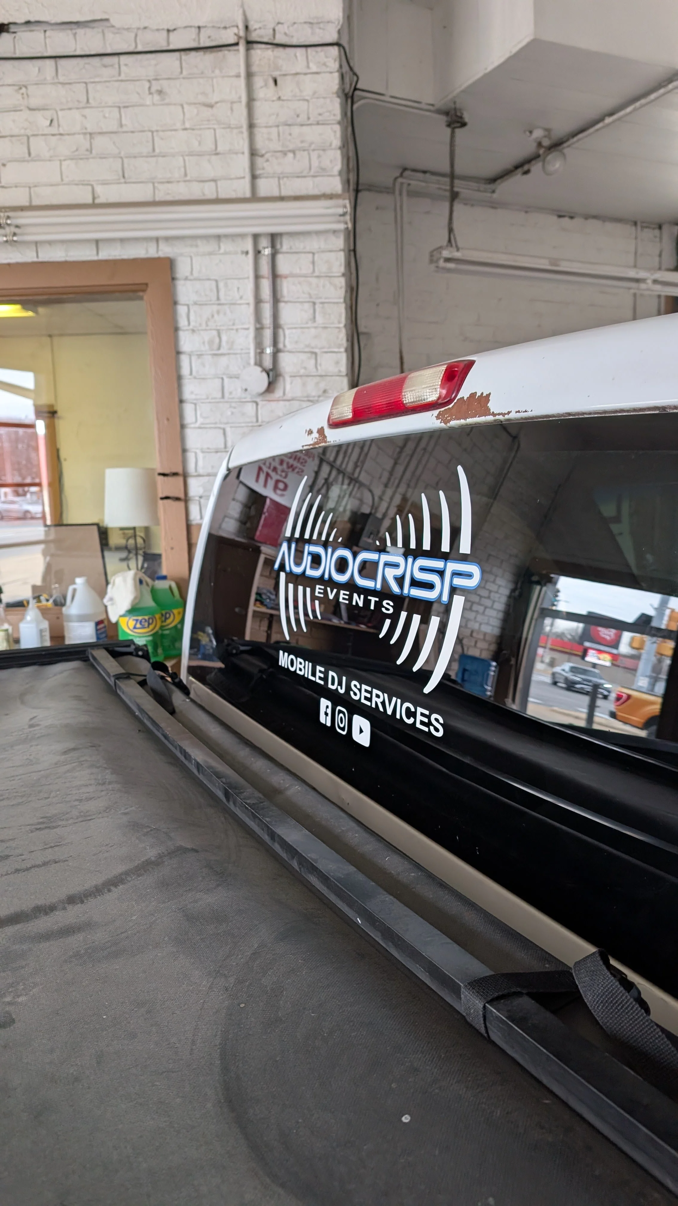 Audio Crisp design and logo decal on a trucks back window