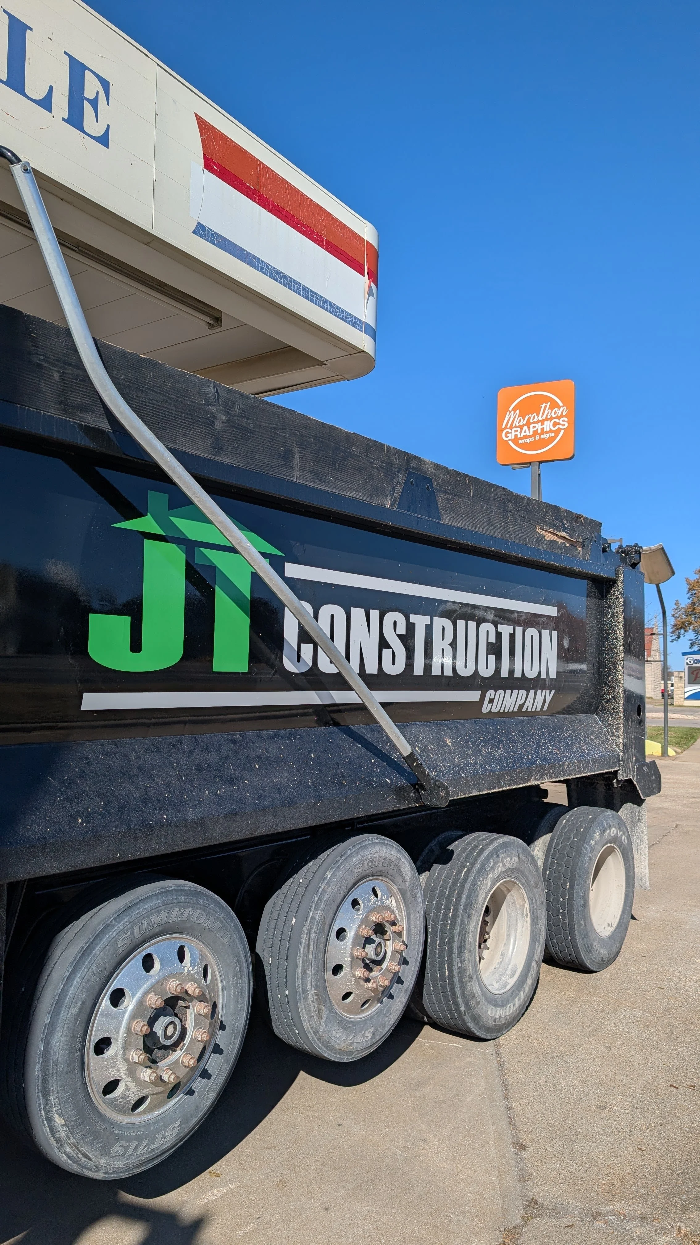 JT Construction Dump truck spot graphic