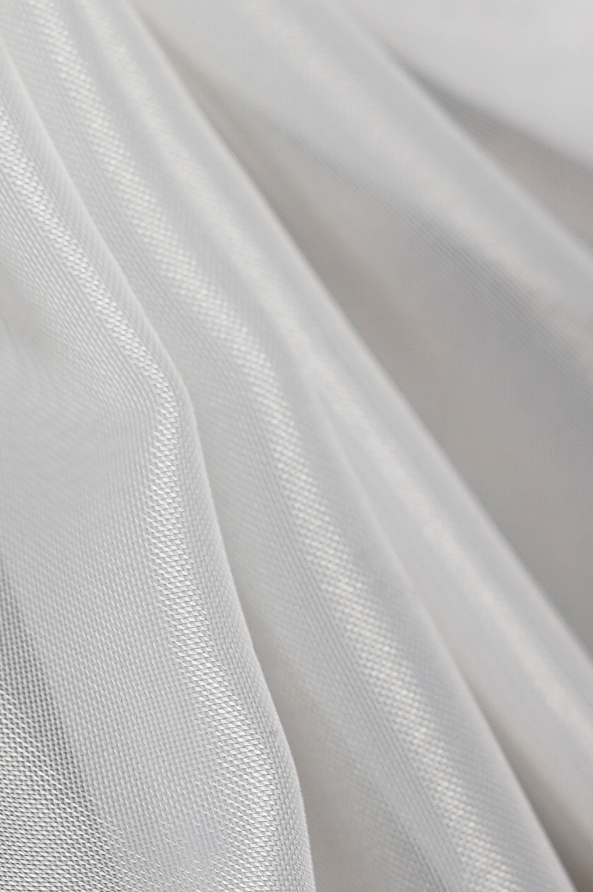 Tela de color blanco con textura de microfibra