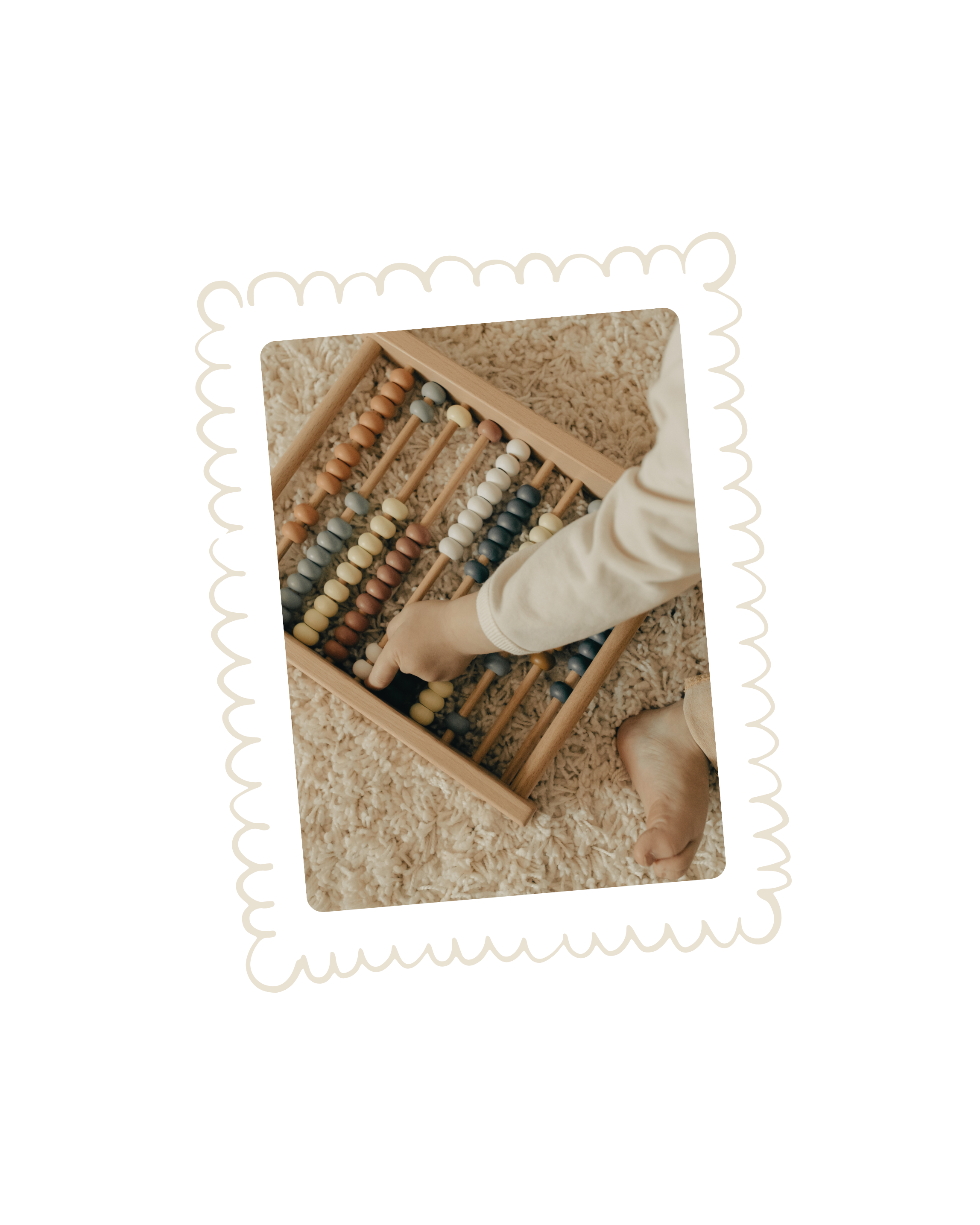 Child playing with a wooden abacus on a plush carpet.