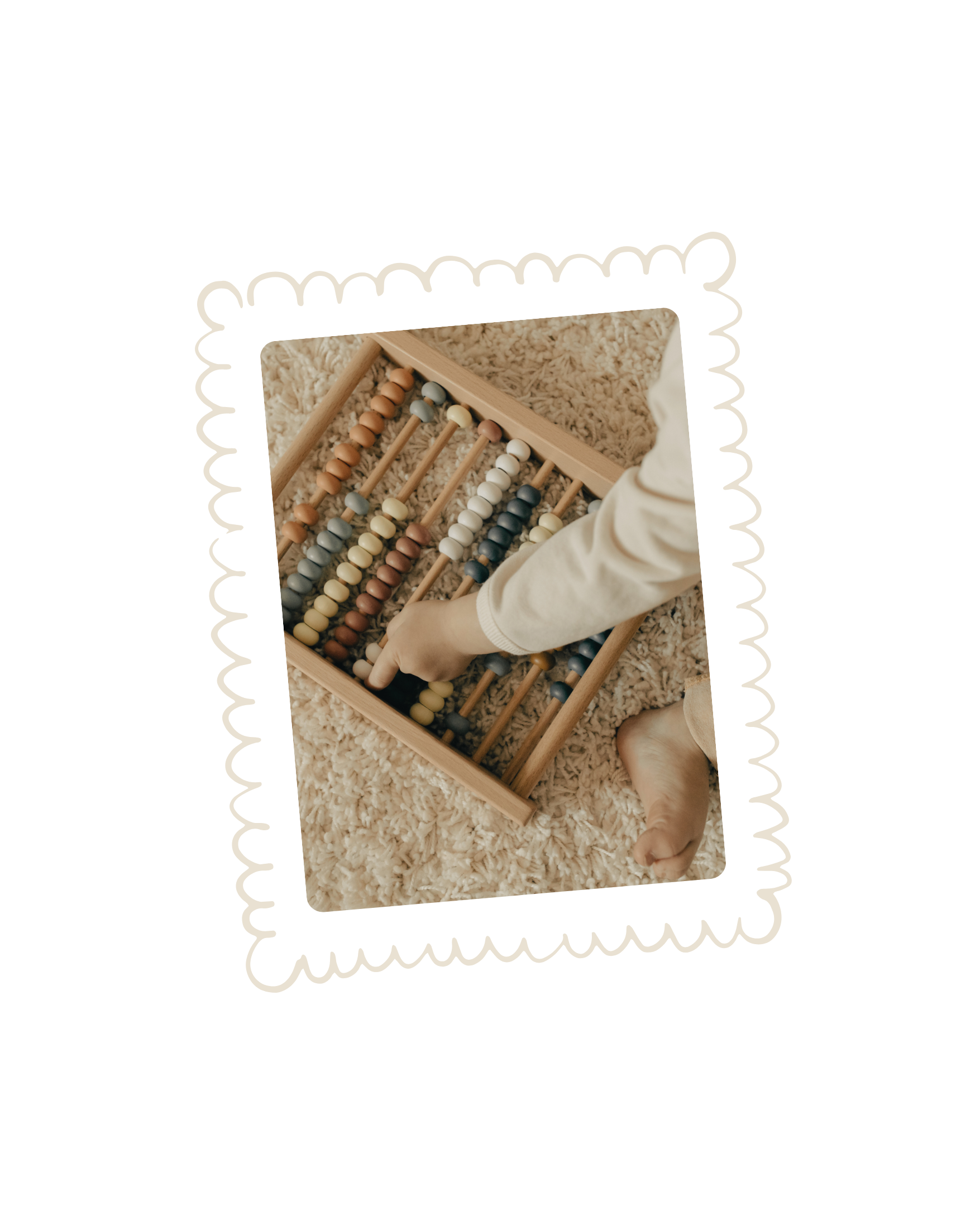 A person playing with a wooden abacus with multicolored beads on a fluffy beige carpet.