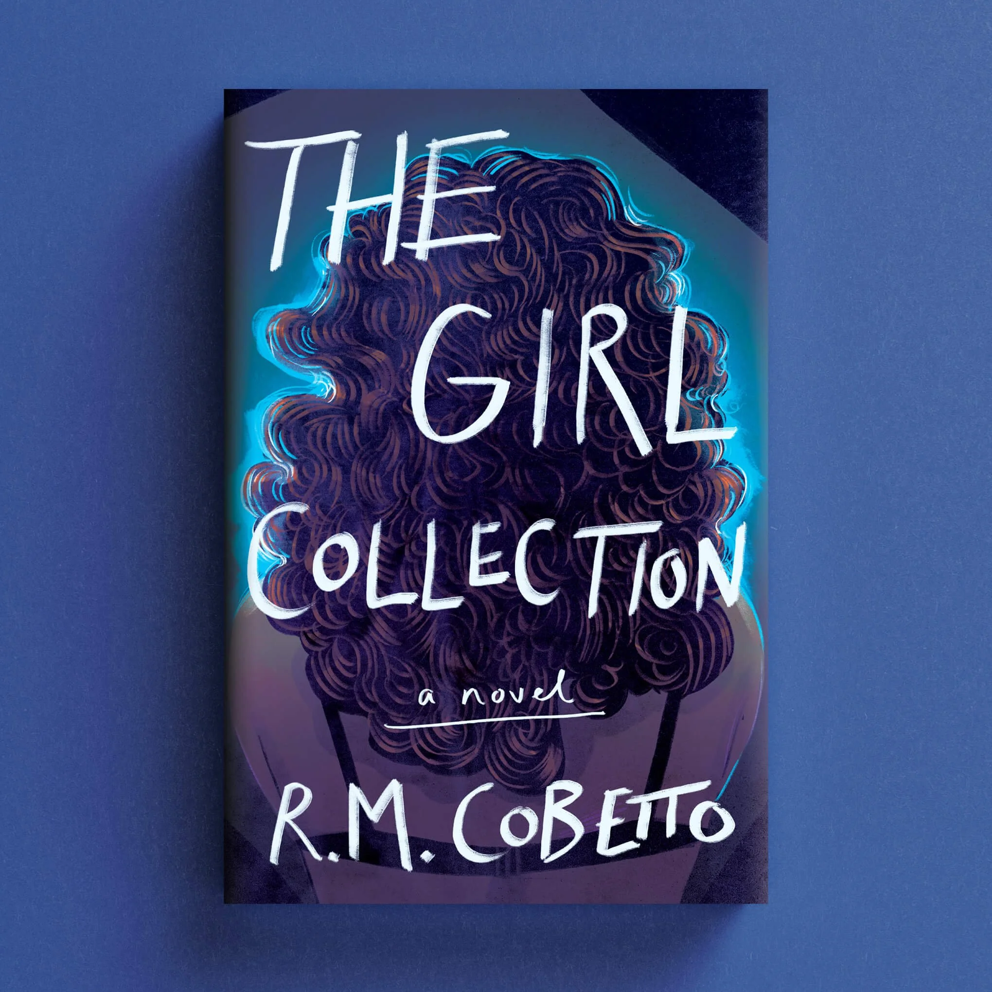 Cover for The Girl Collection with the back of a curly-haired woman outlined in blue light