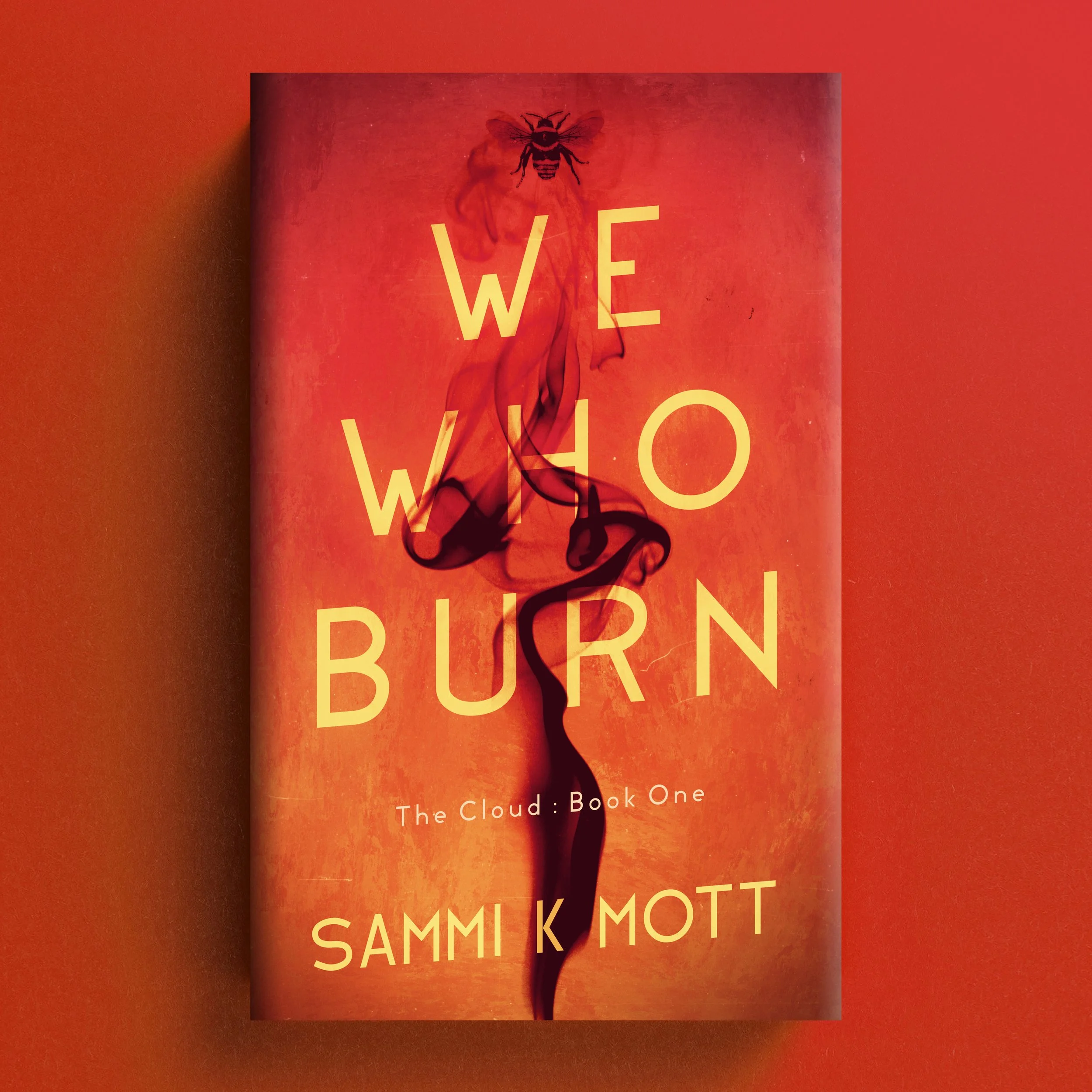 Cover for We Who Burn with orange-red abstract smoke and a black bee motif