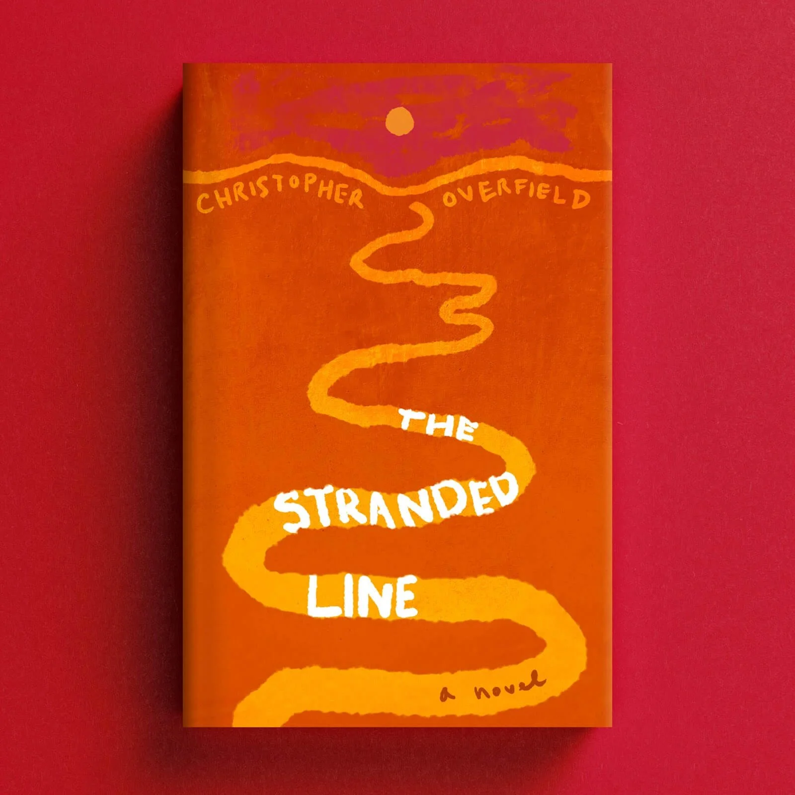 Cover for The Stranded Line with a winding yellow road across an orange landscape