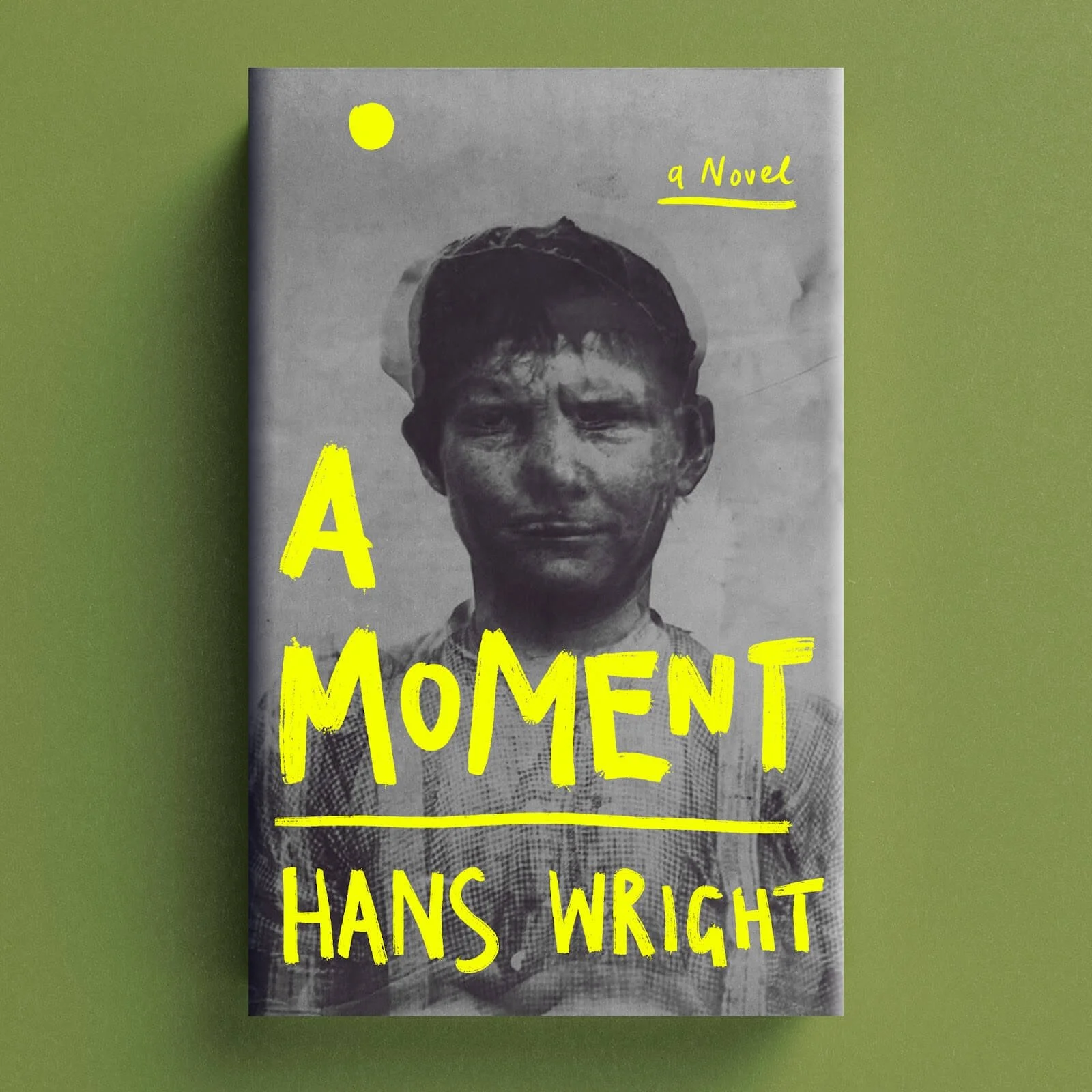 Cover for A Moment with a black-and-white portrait and bright yellow hand-drawn typography