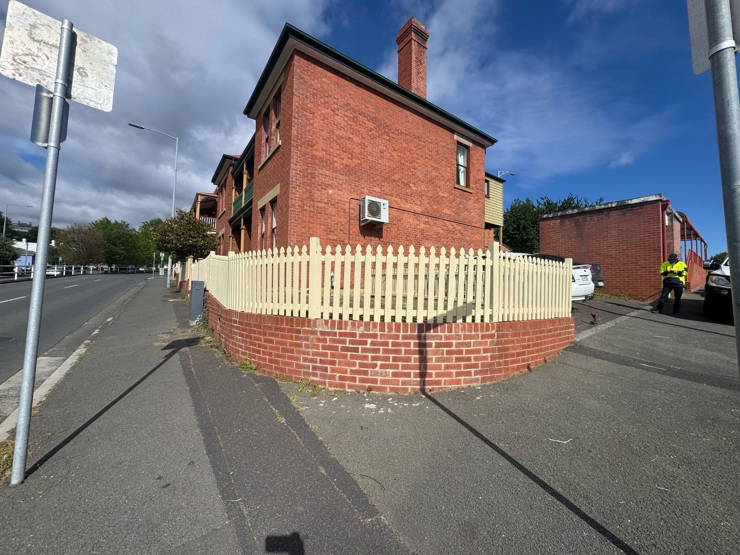 Freshly replaced corner-facing picket fence at Hobart home