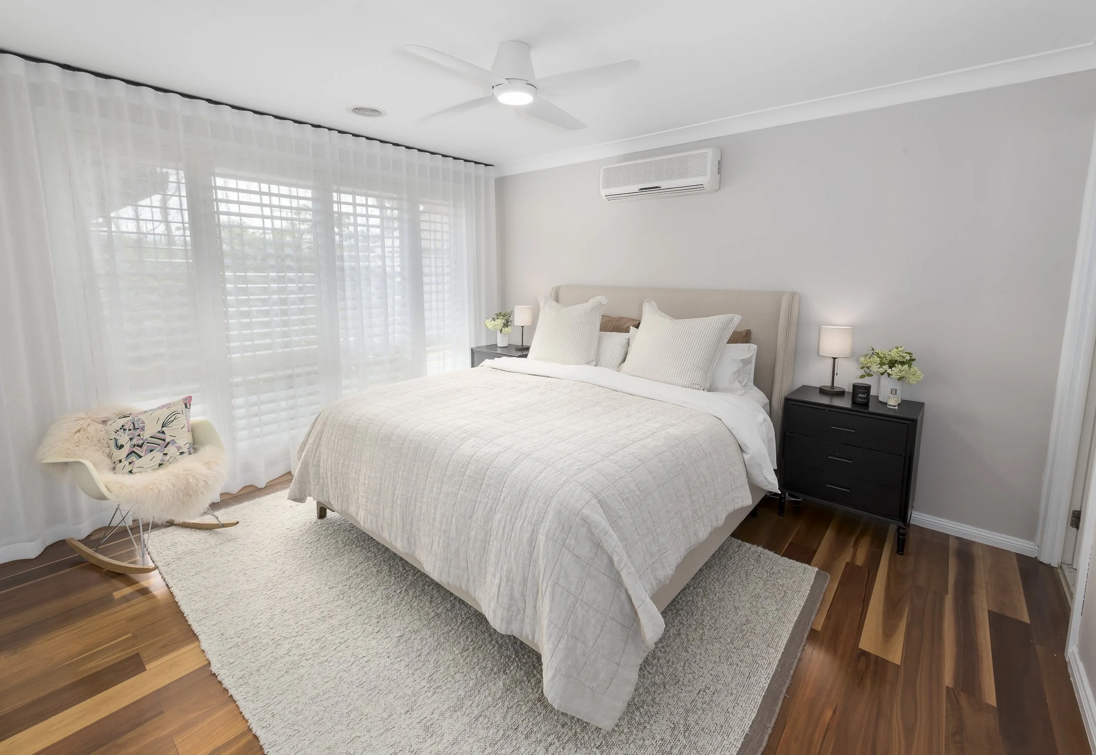 Interior master bedroom with new hardwood floors.