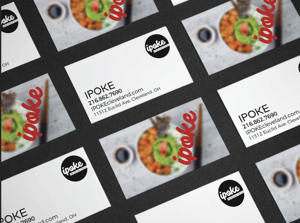 Business cards for Ipoke, a restaurant located at 11312 Euclid Ave., Cleveland, OH, featuring a colorful image of a salad and a cup of coffee, with the word 'poke' written in red cursive.