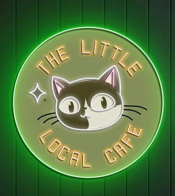 A neon sign of a black and white cat wearing glasses, with the text 'The Little Local Cafe' in a circular layout, against a green background.