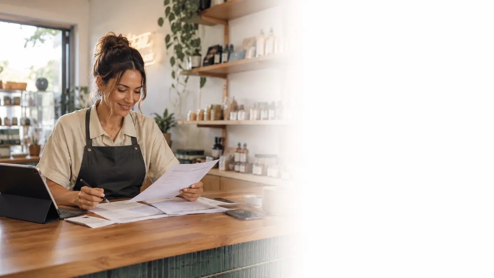 Self-employed business owner reviewing paperwork for alt doc lending options.