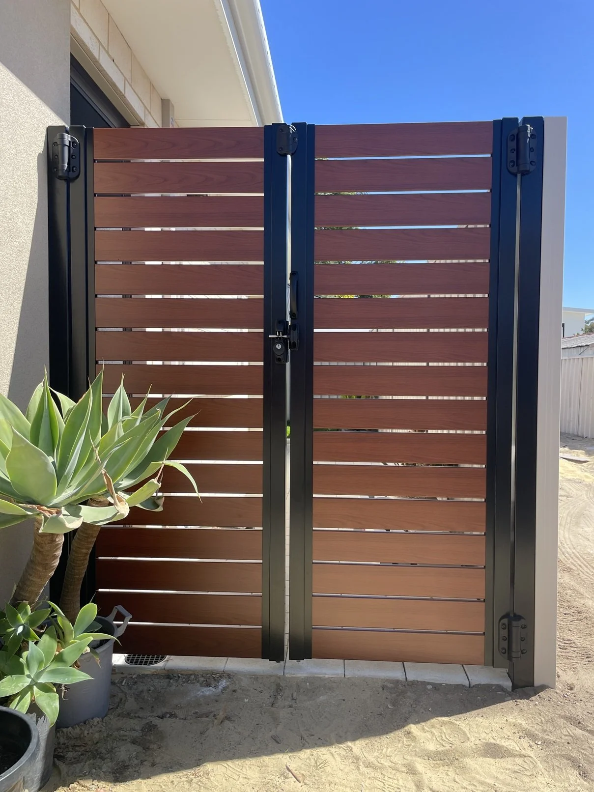 Double aluminium slat gate - Black posts with 100mm Western Red Cedar  slats, 10mm gaps in Yokine
