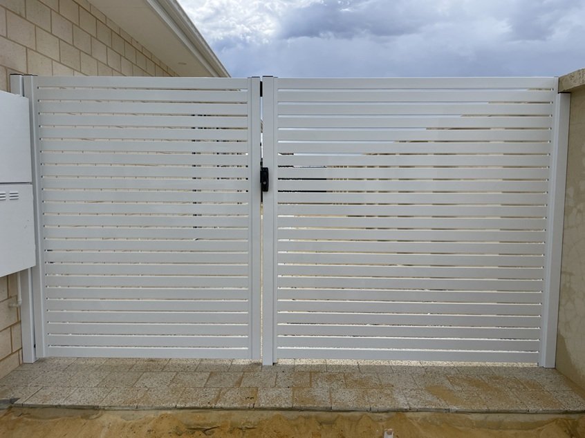 Single aluminium slat gate with infill panel,  65mm Pearl White slats, 10mm gaps in Mindarie