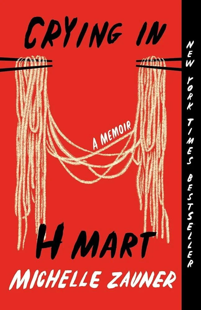 Book cover with red background featuring an illustration of a tangled yarn or string. The title 'Crying in H Mart' by Michelle Zauner is written in bold black and white text, with a subtitle 'A Memoir'. A vertical black sidebar on the right says 'New York Times Bestseller' in white text.