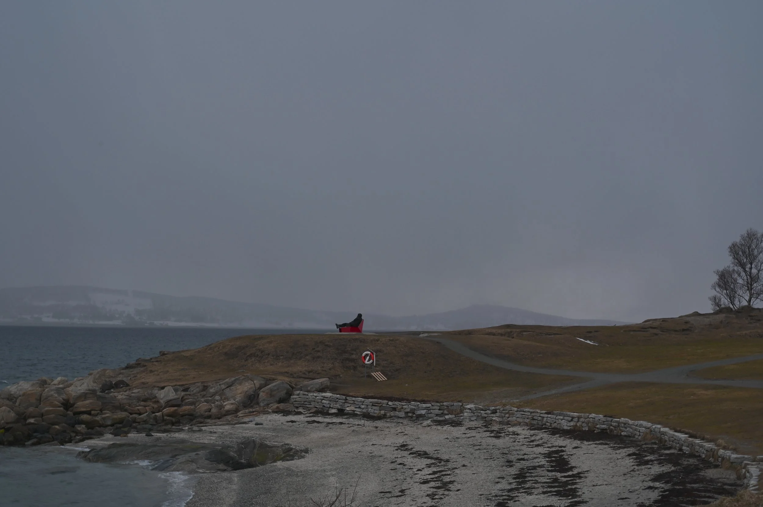 Peaceful coastal scene from Telegrafbukta park in Tromsø, a popular spot for northern lights watching, picnics, and Arctic promenade walks.