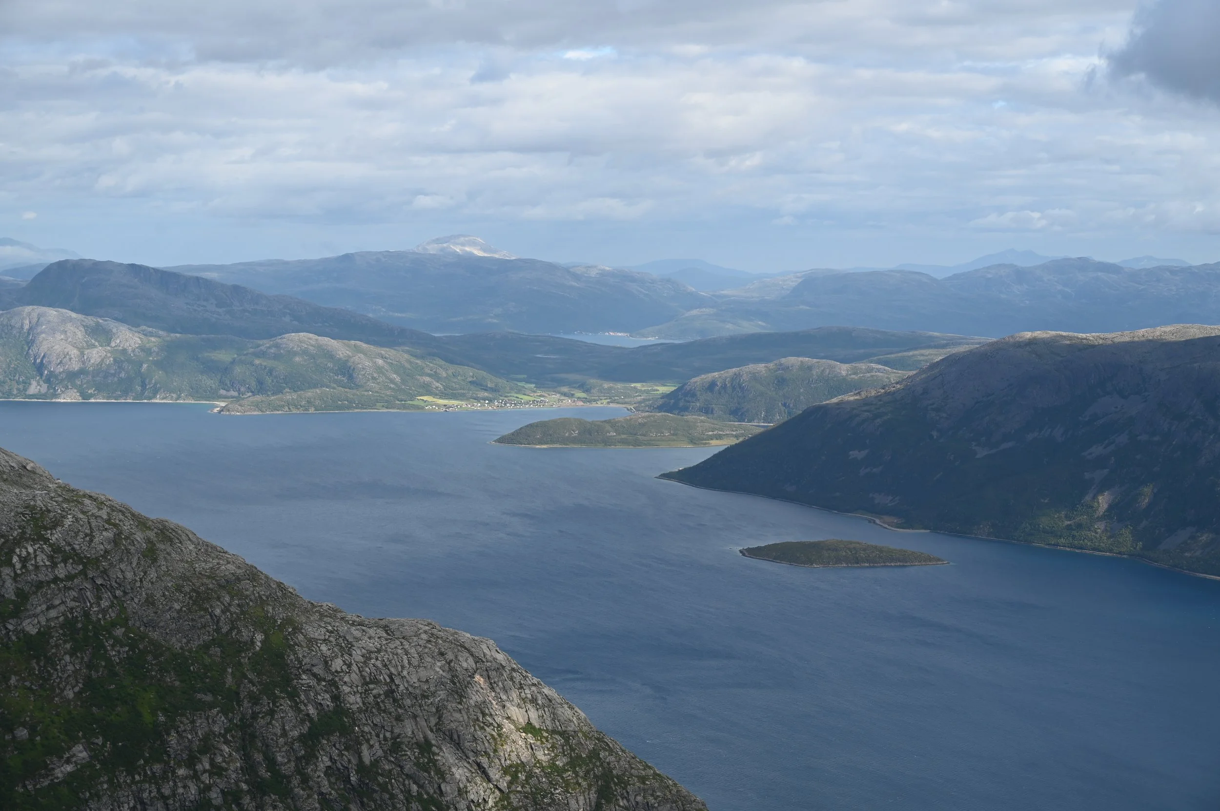 Panoramic view from the summit of Buren mountain overlooking Kaldfjorden and the dramatic Arctic landscape – a classic Norwegian hiking experience near Tromsø.