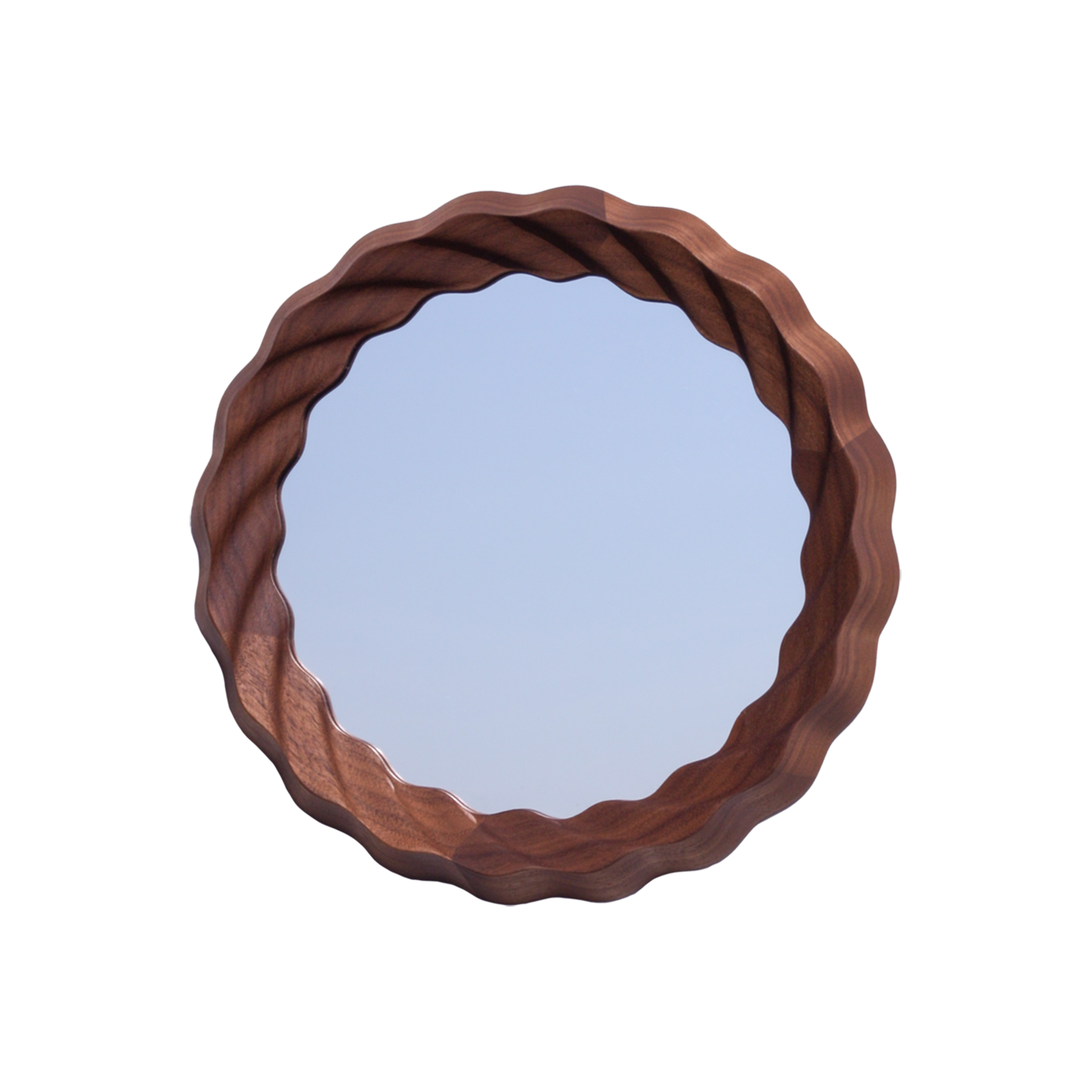 A round mirror with a wavy wooden frame hanging against a black background.