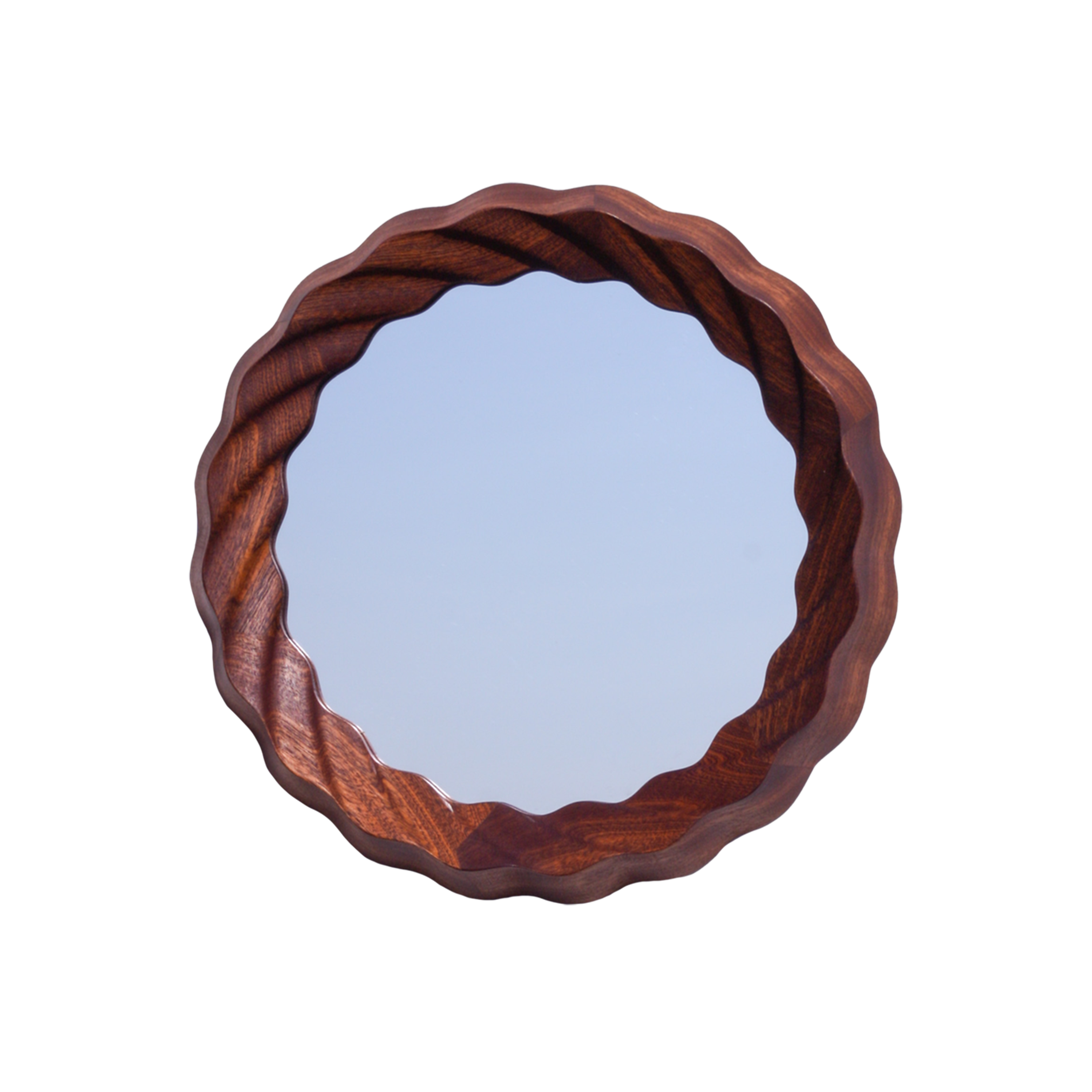 A round mirror with a wavy wooden frame reflecting a plain, light blue wall.