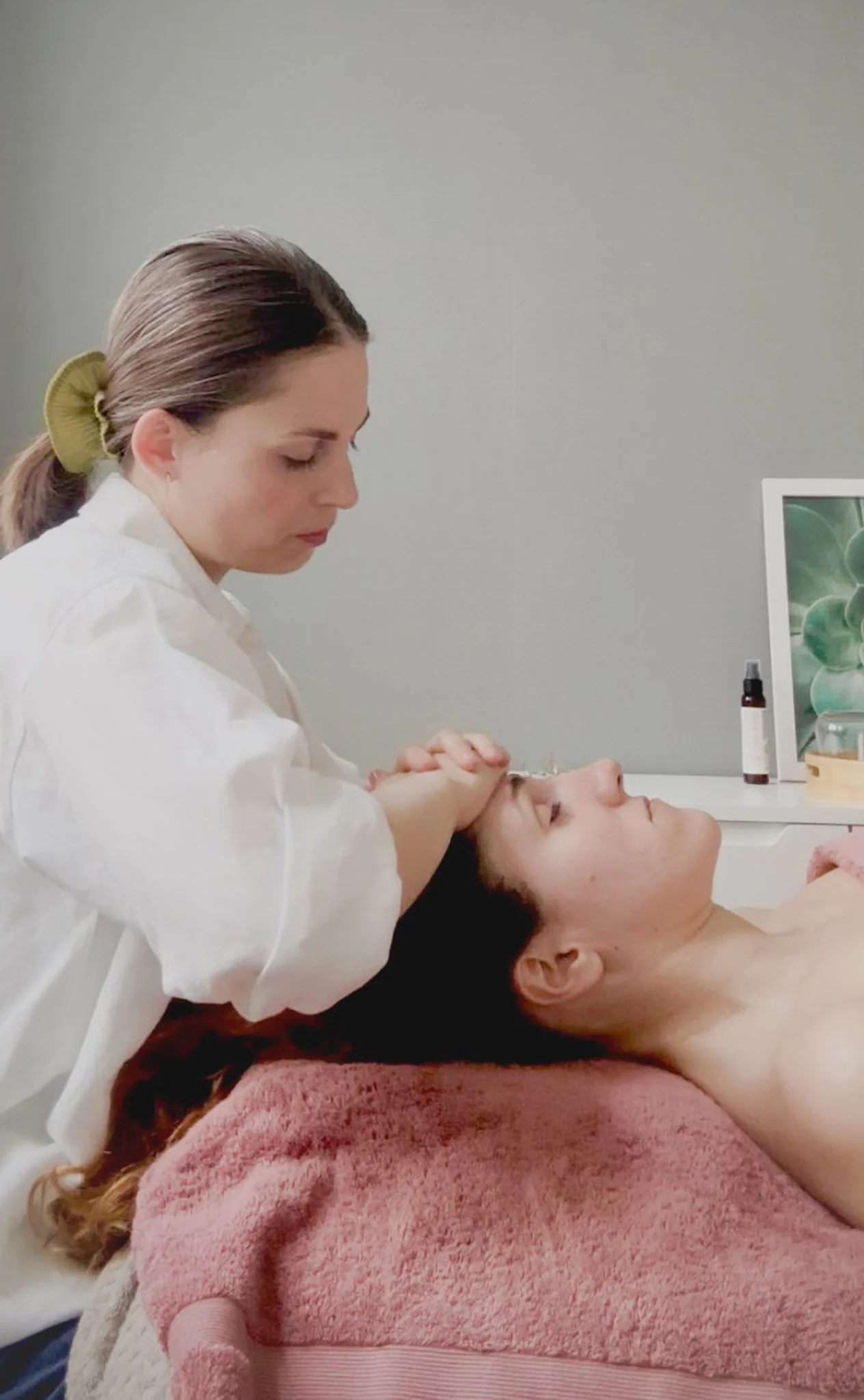 Laura, a French Facialist performing her art of face massage for relaxation and sculpted face