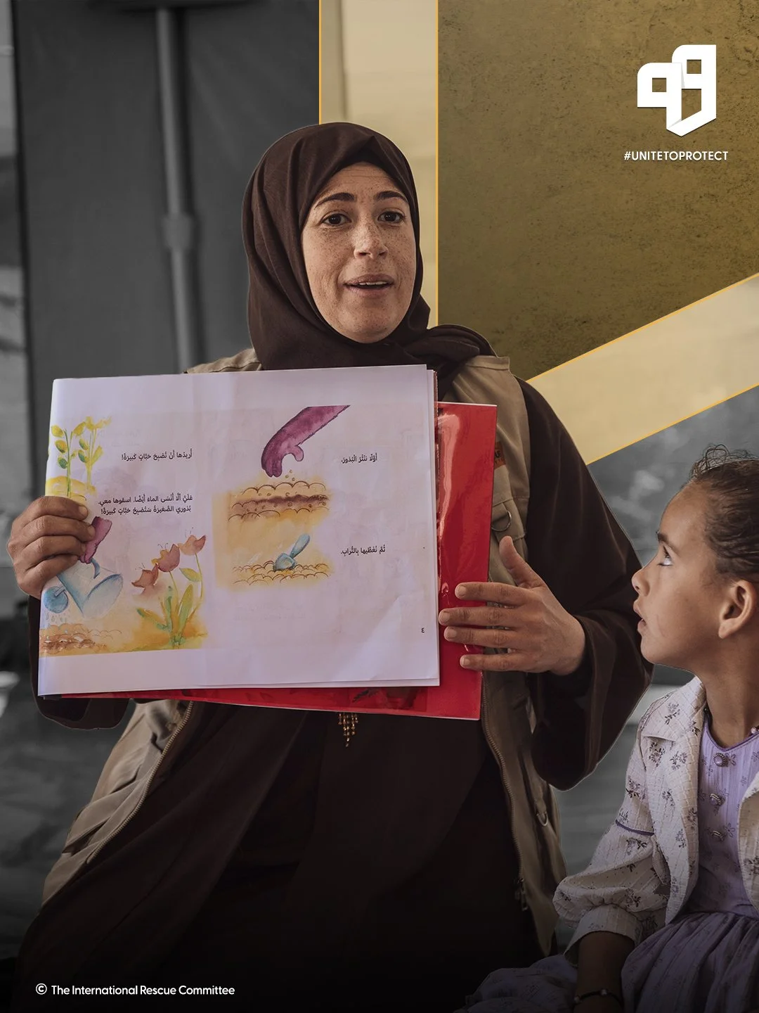 Woman in hijab showing a book with illustrations and Arabic text to a young girl with curly hair. The woman appears to be explaining something, possibly about plants or gardening, based on the illustrations.