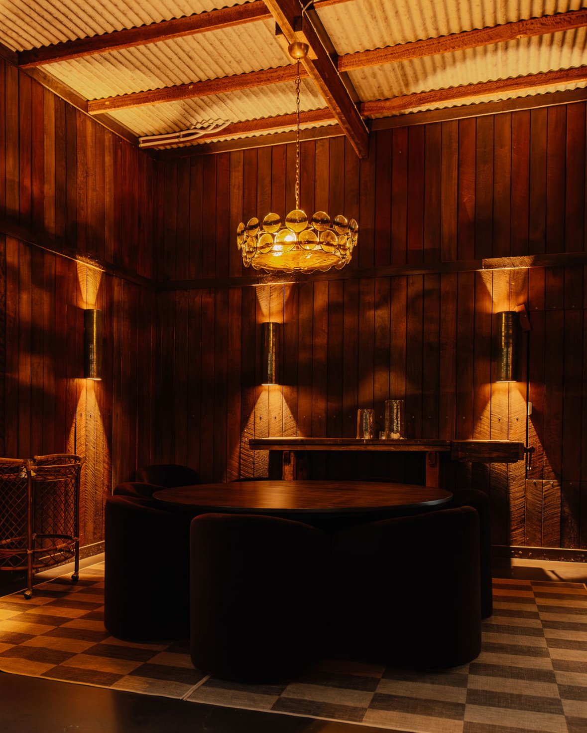 BespokeClose-up of a ceramic or clay tunnel-shaped object on a workshop table, with woodworking tools and materials in the background