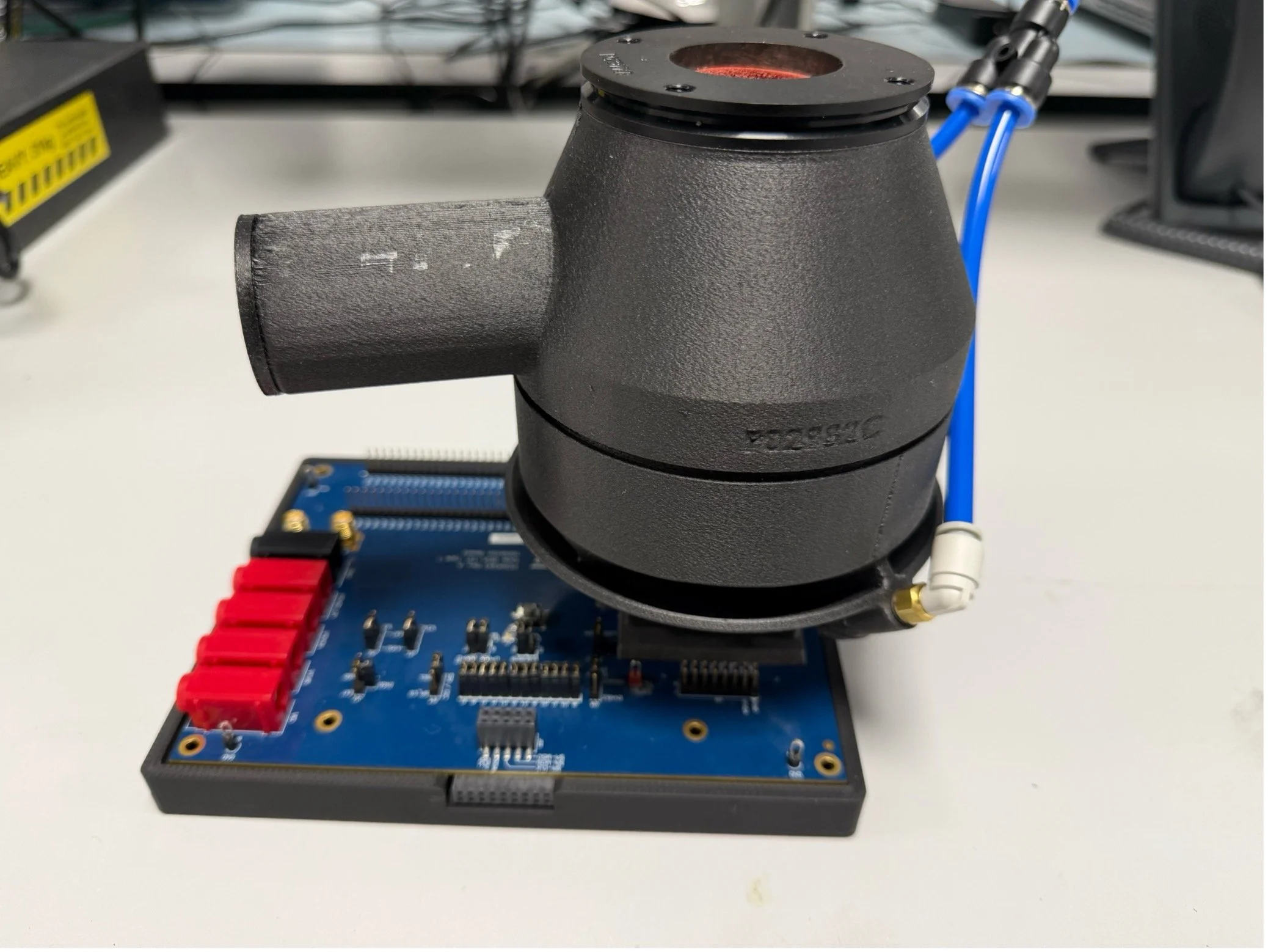 Prototype airflow device mounted on an electronic circuit board.