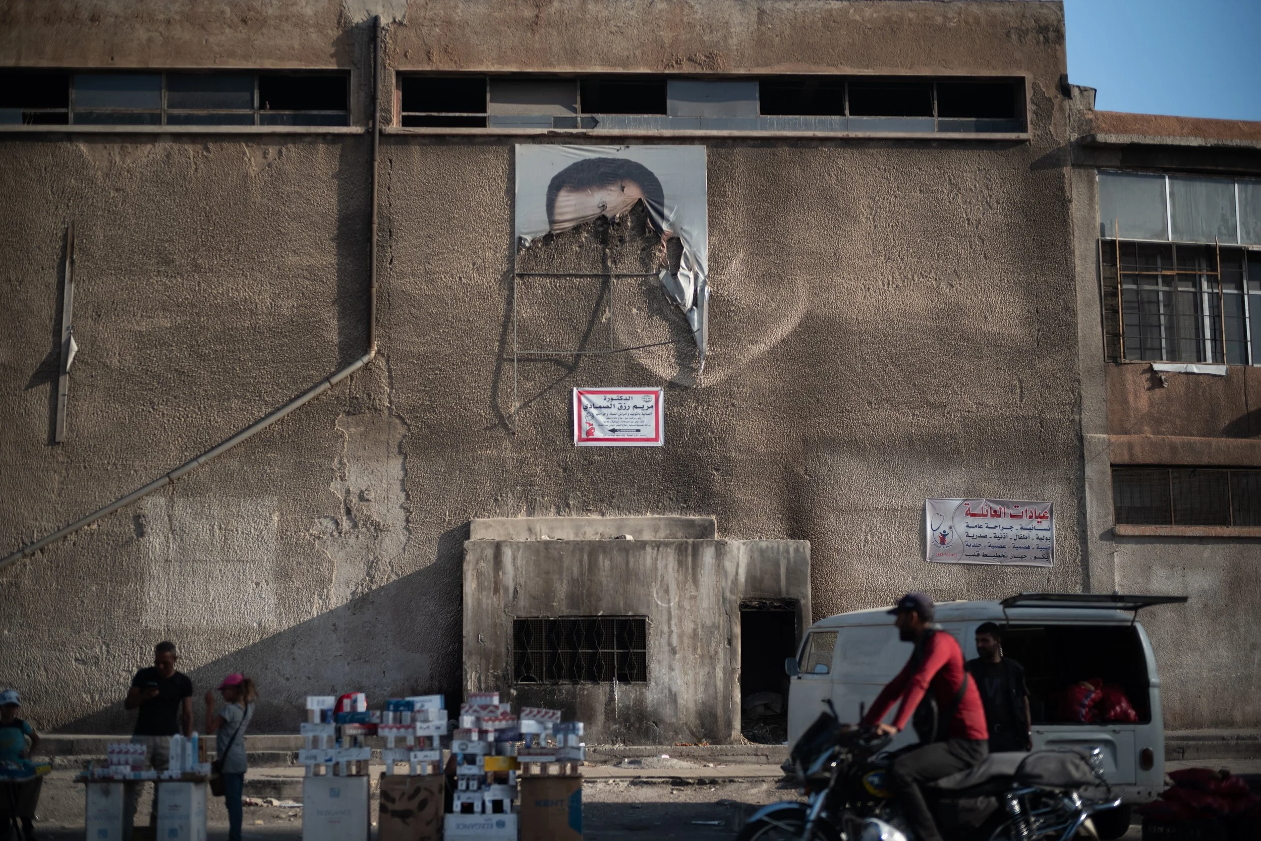 The portrait of Bashar Al-Assad burned on an official building of the former army of the overthrown regime at the entrance of Al-Tadamon, one of the martyr districts of the former regime’s blood-stained policy. Al-Tadamon, Damascus. Syria. 27 May 202