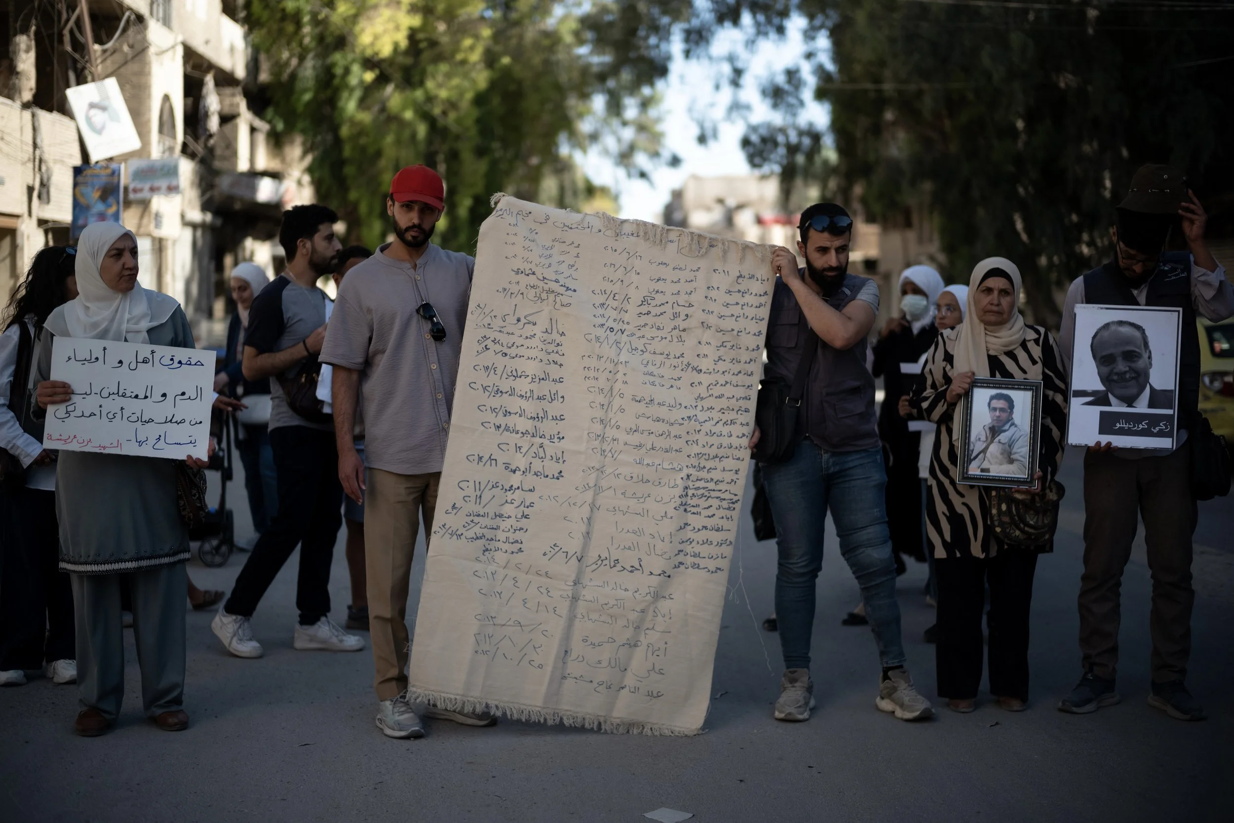 In post Assad Syria, the Tents of Truth allow the families of victims to express themselves about truth and justice. Here in Yarmouk, commonly called Little Palestine, several families have gathered to speak about this essential pursuit of truth and 