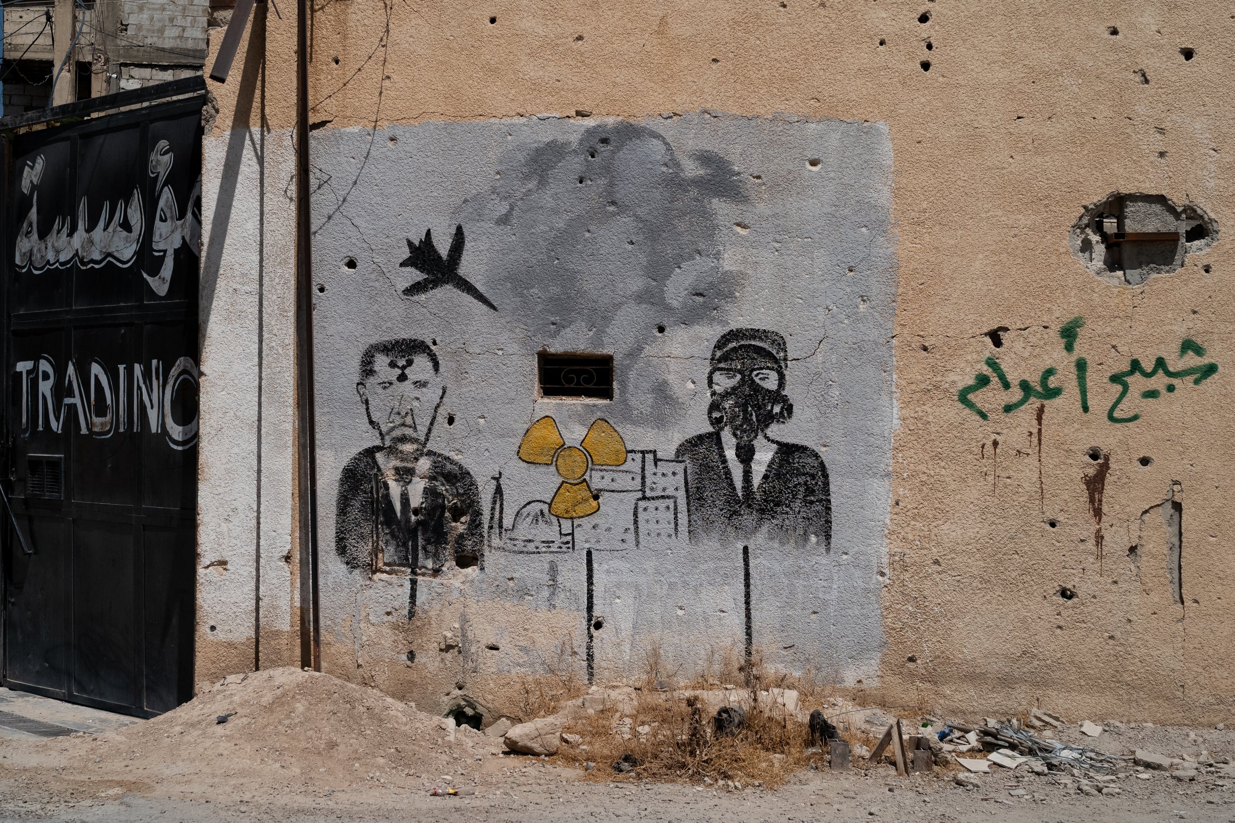 In the Zamalka Cemetery, murals commemorate the victims of the August 21, 2013, attack. Directly across from them, a painting reminds visitors who was behind it. Sentenced to death on August 11, 2026, by the Fourth Criminal Court of Damascus, Bashar 