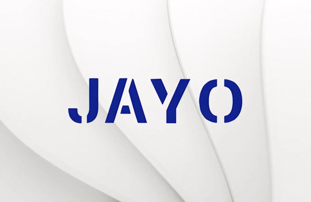 Close-up of a white wall with the word 'JAYO' in bold blue letters.