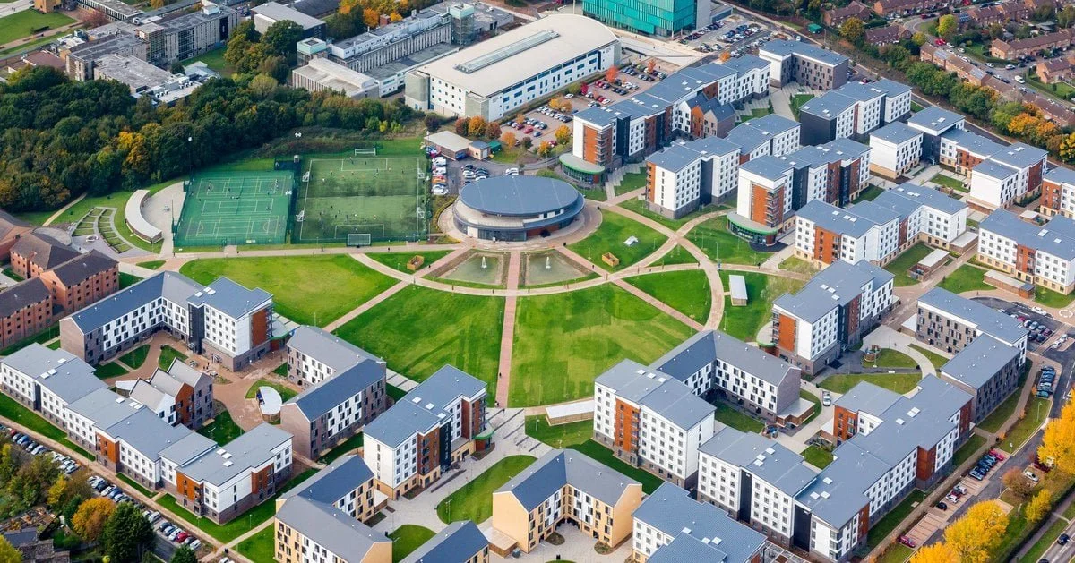 aerial view of modern university campus with student accommodation buildings designed to achieve Net Zero