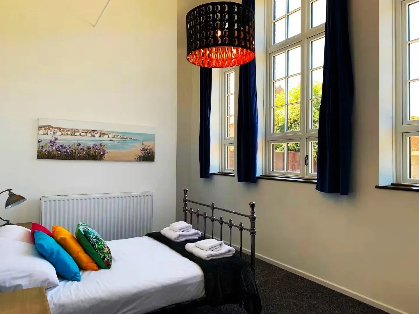 King beds, high ceilings, big windows & en-suites. TVs in every room.

(Bedroom 3)